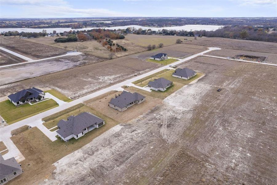 Front exterior of a new home in , Waxahachie, TX, highlighting curb appeal (Image 11).