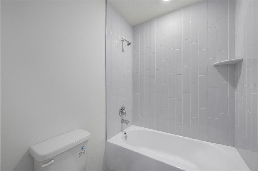 Furnished interior view inside a new home in Peach Crossings, Winter Haven (Image 10).