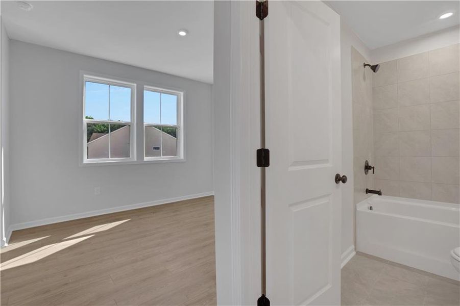 Spacious, unfurnished interior of a new home in The Paddocks at Doc Hughes, Buford (Image 45).