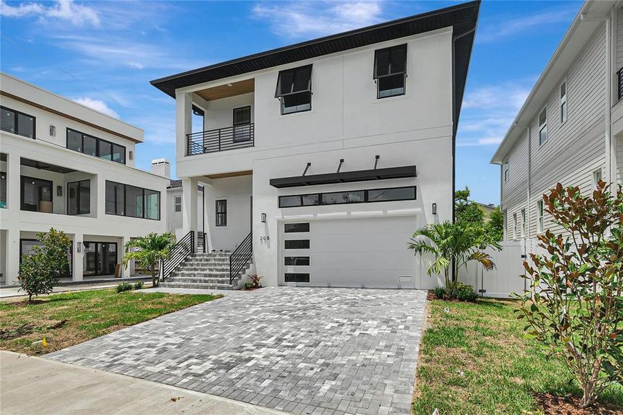 Front exterior of a new home in , Tampa, FL, highlighting curb appeal (Image 26).