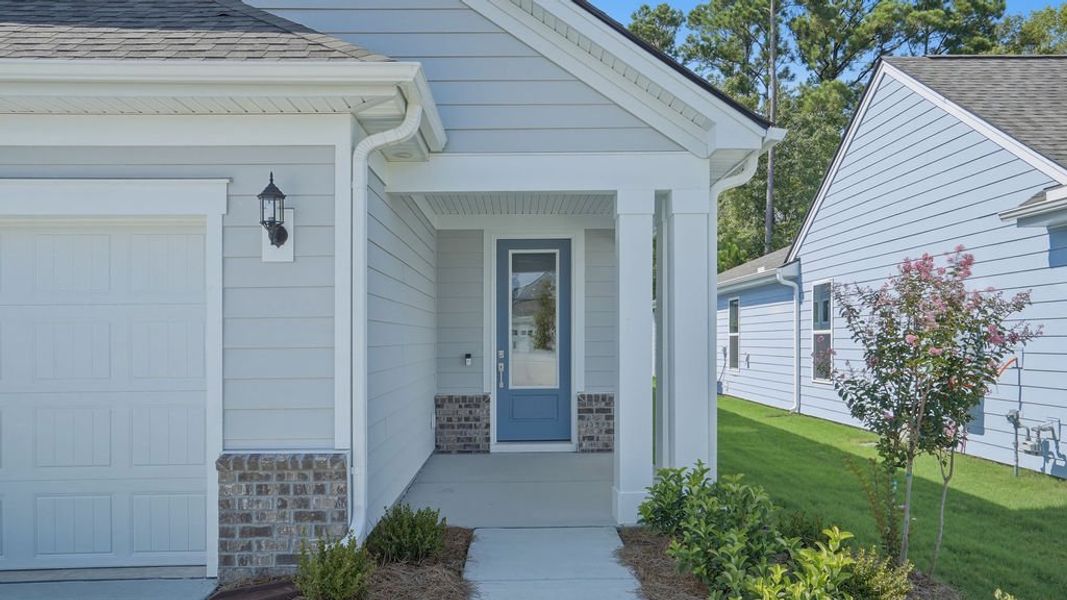 Exterior details and patio area of a home in Sun City Hilton Head, Bluffton (Image 22).