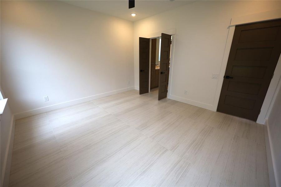 Unfurnished bedroom featuring ceiling fan and recessed lighting