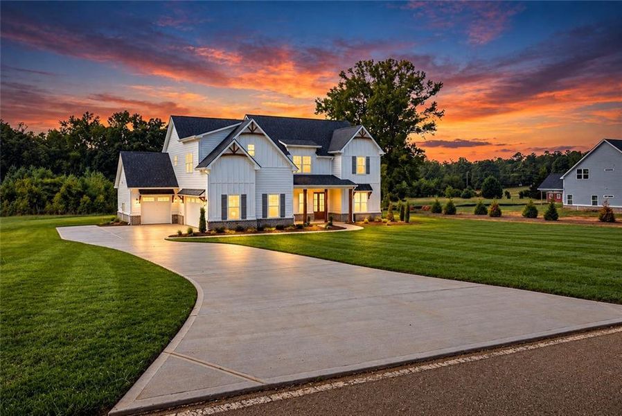 Front exterior of a new home in , Hampton, GA, highlighting curb appeal (Image 25). Front exterior of a new home in , Hampton, GA, highlighting curb appeal (Image 25).
