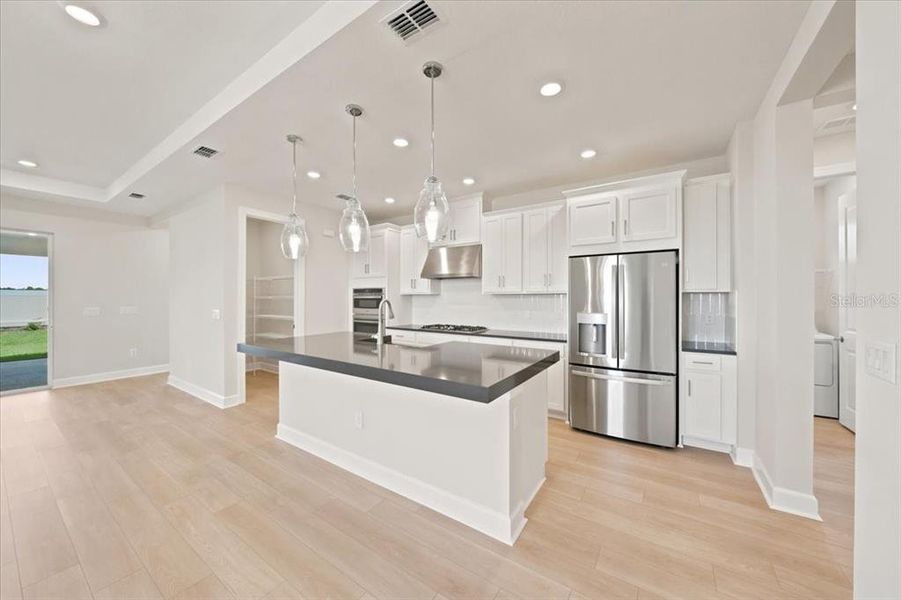 Furnished interior view inside a new home in Coasterra Community Group Page, Palmetto (Image 8).
