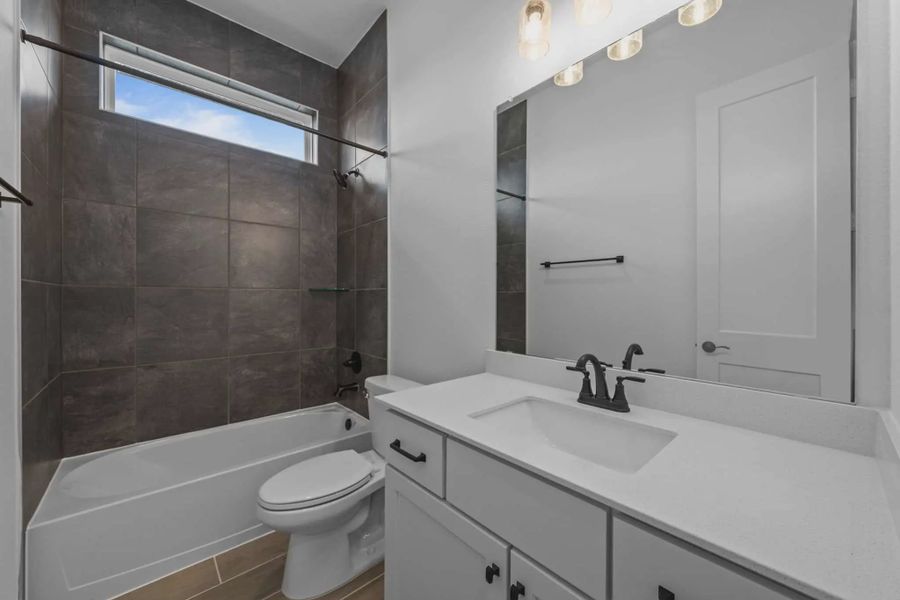 Representative furnished interior of a home built from the Augusta by Chesmar Homes in Riceland Alley Loads, Mont Belvieu (Image 9).