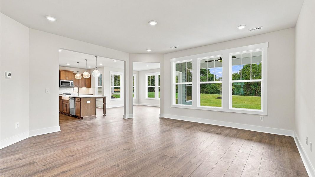 Spacious family room with accomplished design and eye-catching details throughout