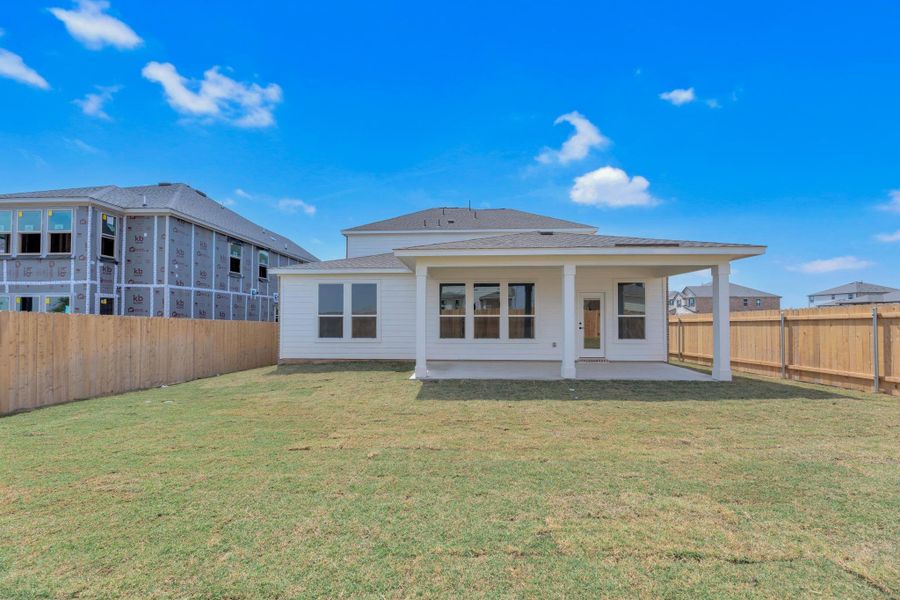 Front exterior of a new home in Salerno - Classic Collection, Round Rock, TX, highlighting curb appeal (Image 26). Front exterior of a new home in Salerno - Classic Collection, Round Rock, TX, highlighting curb appeal (Image 26).