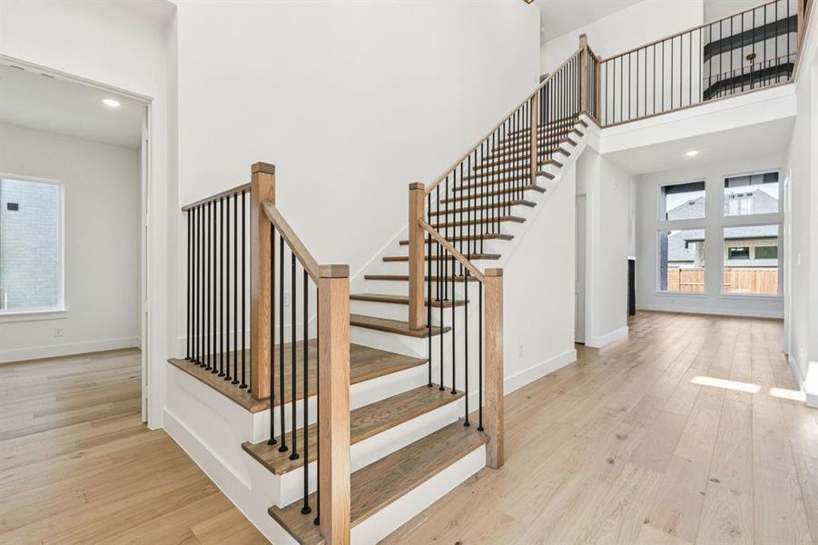 This gorgeous open and airy entry is the perfect place to welcome friends and family into your stunning new home!