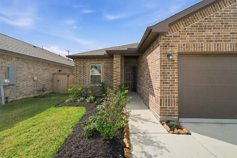 Exterior details and patio area of a home in Windrose Green, Angleton (Image 3).
