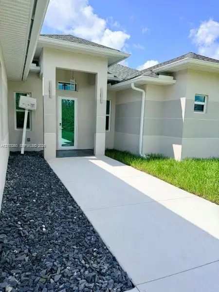Exterior details and patio area of a home in , Lehigh Acres (Image 3).