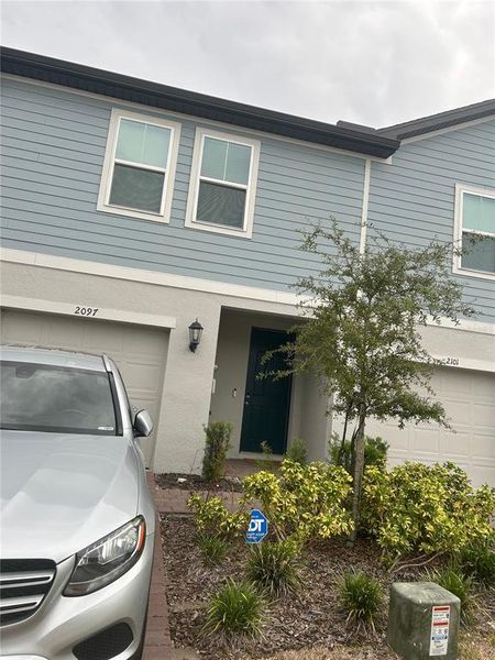 Front exterior of a new home in , Orlando, FL, highlighting curb appeal (Image 2).