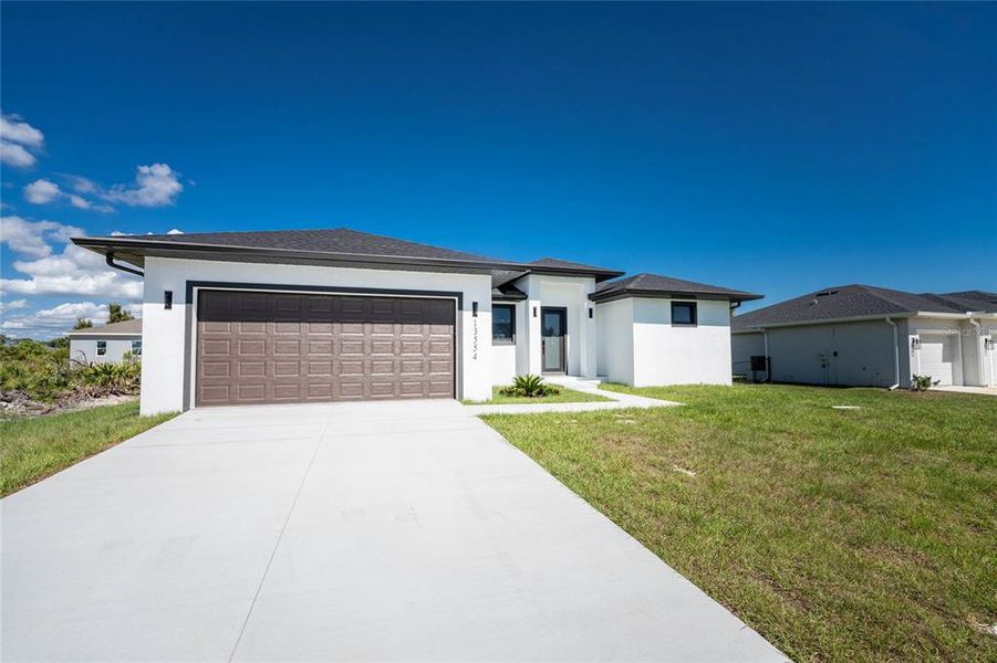 Front exterior of a new home in , Port Charlotte, FL, highlighting curb appeal (Image 27).