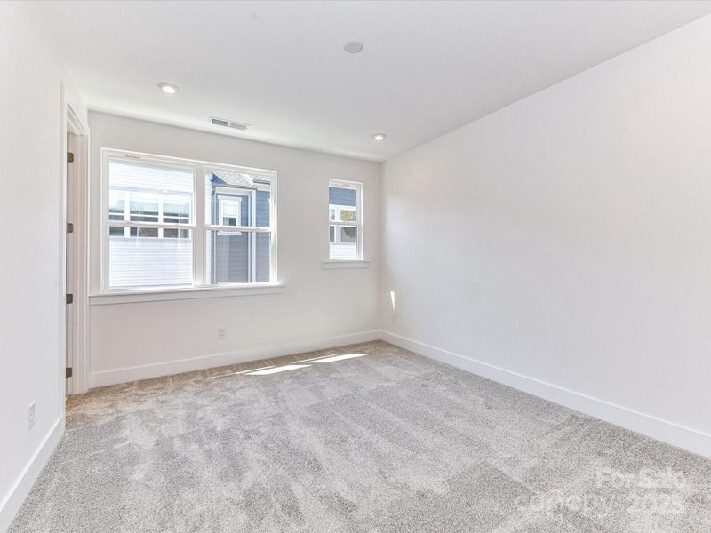 A Primary Suite Bathed In Natural Light.