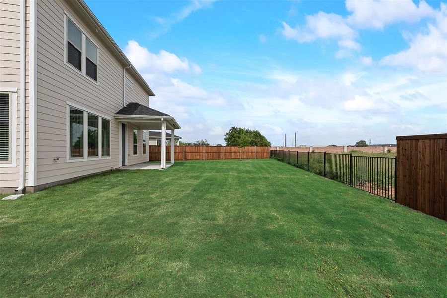 Front exterior of a new home in Creekside of Crowley, Crowley, TX, highlighting curb appeal (Image 17). Front exterior of a new home in Creekside of Crowley, Crowley, TX, highlighting curb appeal (Image 17).