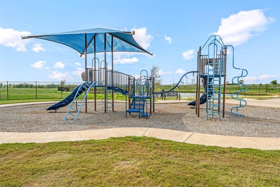 Community jungle gym with a lawn