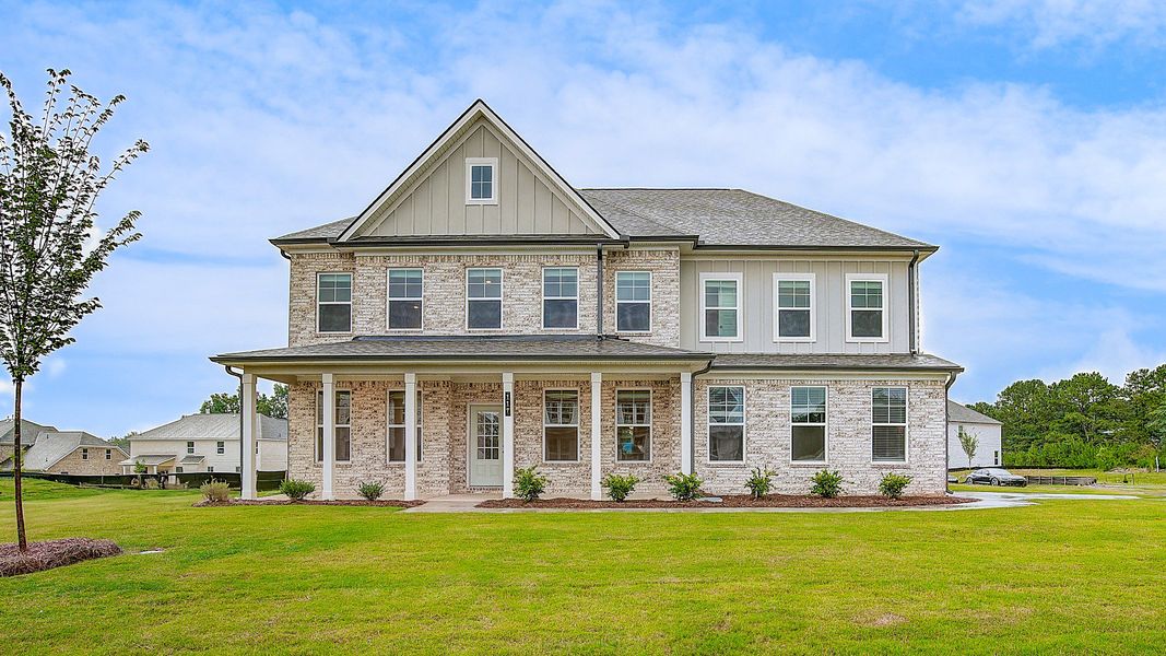 Representative exterior photo of a completed home built from the Stonefield by DRB Homes in Westwind Estates, Hampton, GA (Image 20).