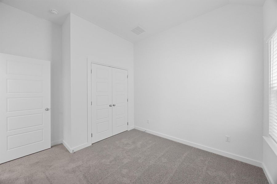 Bedroom in the Pecan II home plan by Trophy Signature Homes – REPRESENTATIVE PHOTO