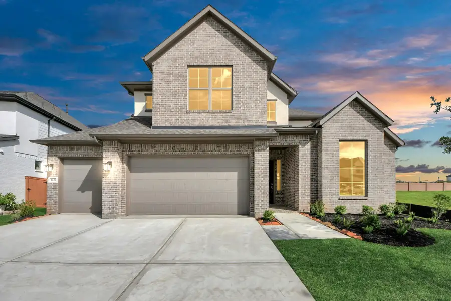 Front exterior of a new home in Marvida, Cypress, TX, highlighting curb appeal (Image 2).