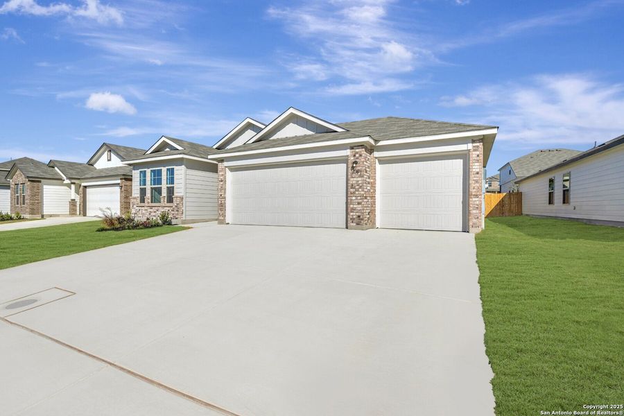 Front exterior of a new home in Greenspoint Heights, Seguin, TX, highlighting curb appeal (Image 2).
