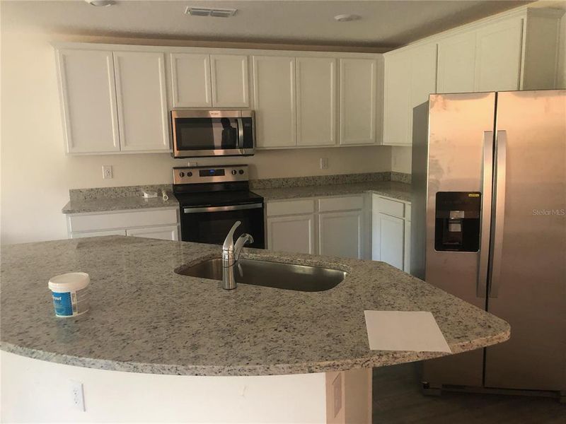 Furnished interior view inside a new home in , Kissimmee (Image 7).