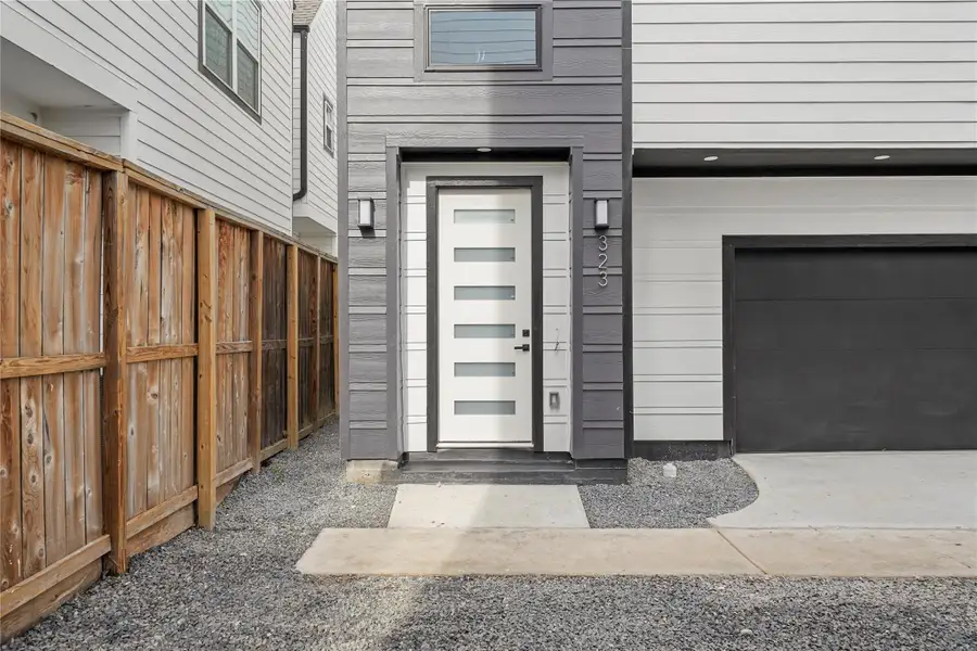 With modern finishes and fixtures inside and out, the front porch offers a welcoming entrance with an 8-foot glass panel door and two coach lights. The smart garage has a MyQ app and a separate storage room.