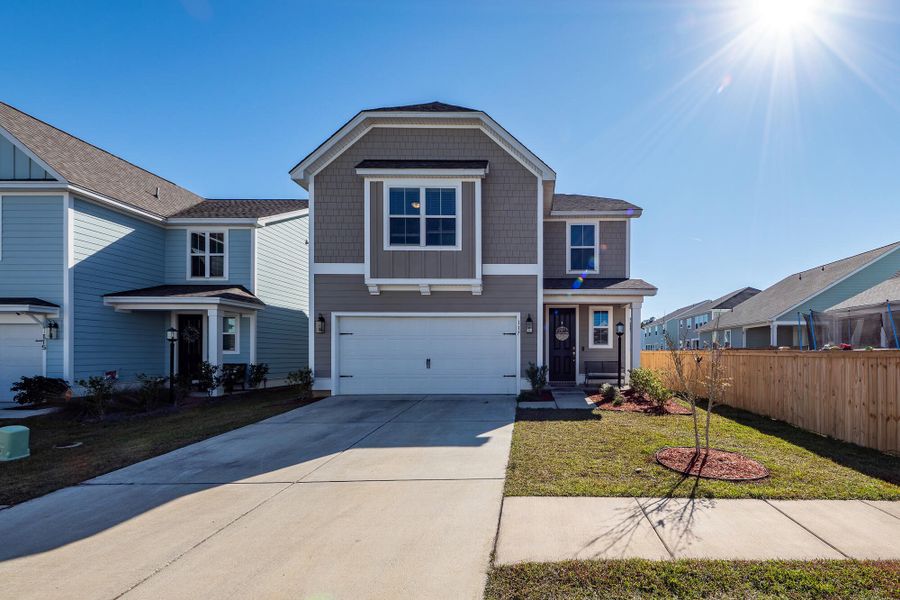 Front exterior of a new home in High Point at Foxbank, Moncks Corner, SC, highlighting curb appeal (Image 2).