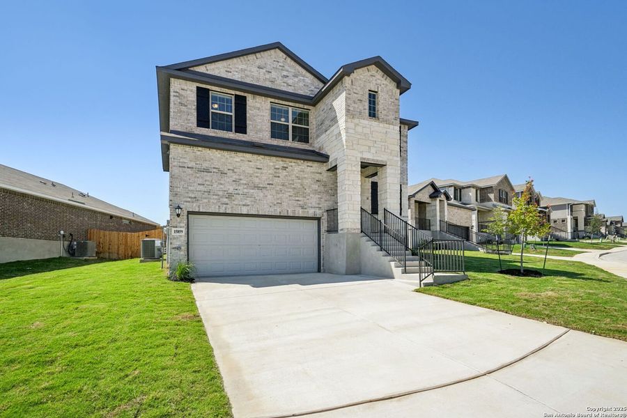 Front exterior of a new home in Comanche Ridge, San Antonio, TX, highlighting curb appeal (Image 22). Front exterior of a new home in Comanche Ridge, San Antonio, TX, highlighting curb appeal (Image 22).