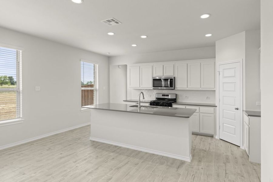 Representative exterior photo of a completed home built from the Cottonwood by Impression Homes in Northspur, Terrell, TX (Image 7).