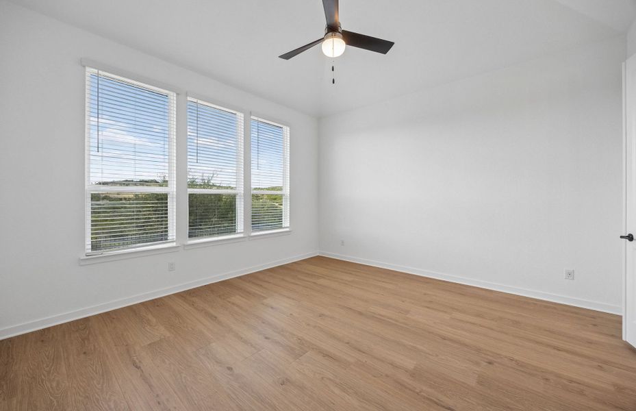 Representative unfurnished interior of a home built from the Wheeler by Pulte Homes in West Cypress Hills, Spicewood (Image 15).