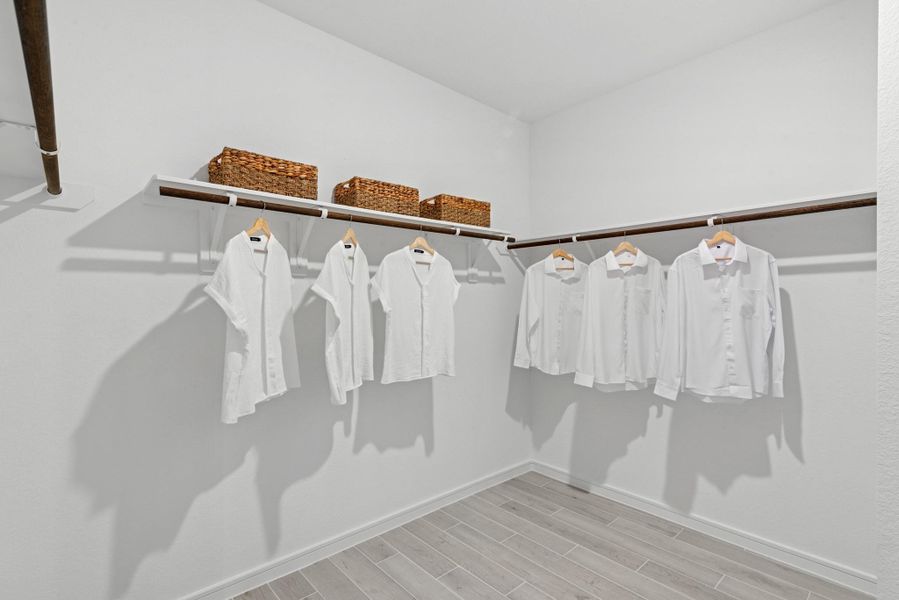 Walk-in closet in the primary suite (*Photo not of actual home and used for illustration purposes only.) Walk-in closet in the primary suite (*Photo not of actual home and used for illustration purposes only.)
