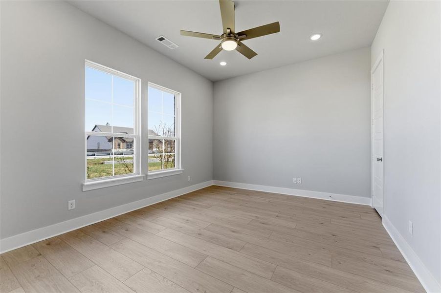 Unfurnished room featuring light wood-style flooring, recessed lighting, and a ceiling fan