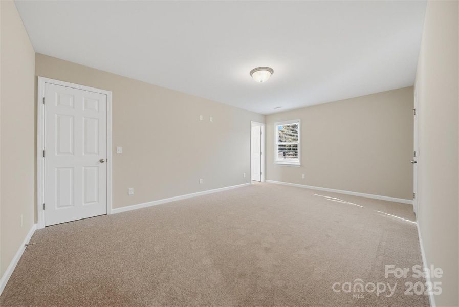 Primary bedroom with 2 Walkin closets!