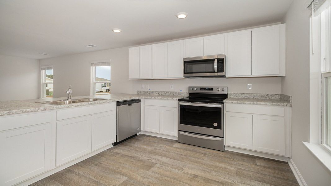 Representative furnished interior of a home built from the LEWIS by D.R. Horton in Sutton Farm, Loris (Image 3).