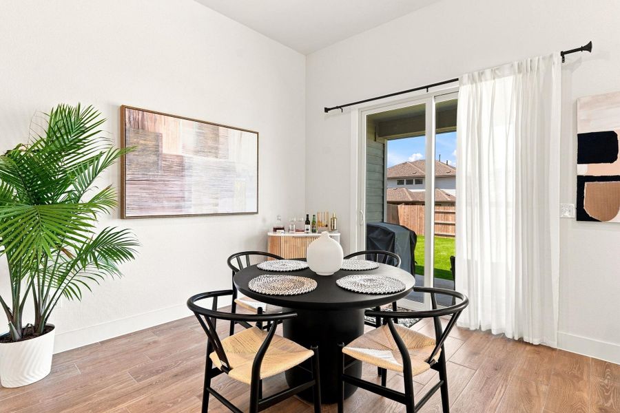 Dedicated dining area directly off the kitchen, featuring an upgraded 6'x8' sliding glass door leading out to the covered patio. Dedicated dining area directly off the kitchen, featuring an upgraded 6'x8' sliding glass door leading out to the covered patio.
