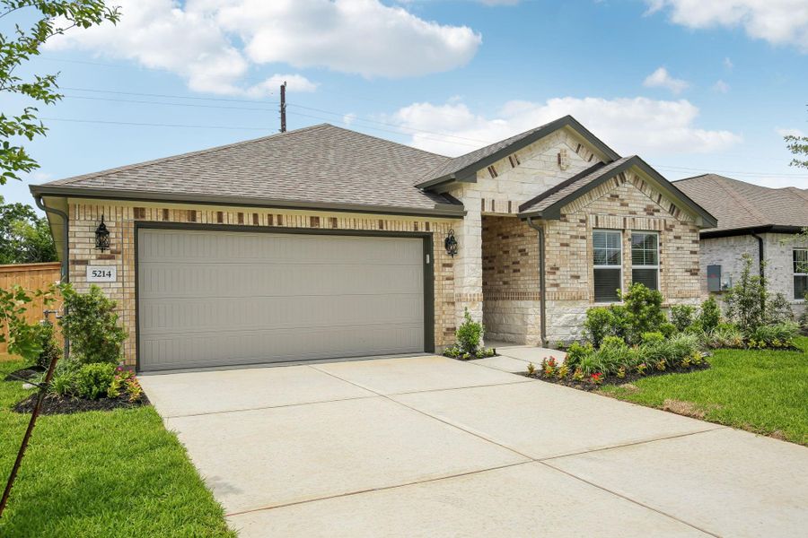 Front exterior of a new home in Massey Oaks - Premier Series, Pearland, TX, highlighting curb appeal (Image 23). Front exterior of a new home in Massey Oaks - Premier Series, Pearland, TX, highlighting curb appeal (Image 23).