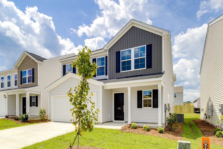 Front exterior of a new home in Winston Point, Gilbert, SC, highlighting curb appeal (Image 17). Front exterior of a new home in Winston Point, Gilbert, SC, highlighting curb appeal (Image 17).