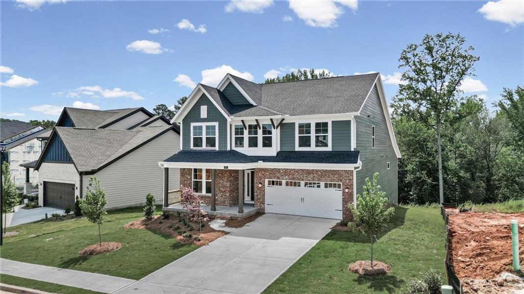 Front exterior of a new home in Twin Lakes, Hoschton, GA, highlighting curb appeal (Image 26).