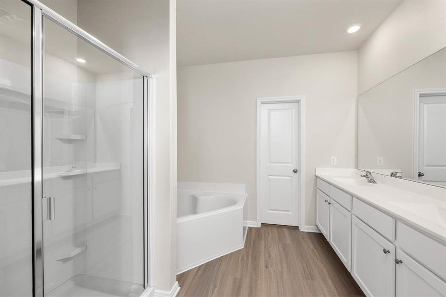 Give yourself time to primp and pamper in your en-suite bathroom featuring a soaking tub, step-in glass shower with tiled walls, dual sink vanity and walk-in closet. This master suite provides you with all the privacy you want and need from the moment you move in.