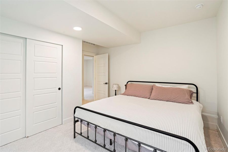 Private basement bedroom with soft natural light, perfect for guests, a home office, or flexible living space