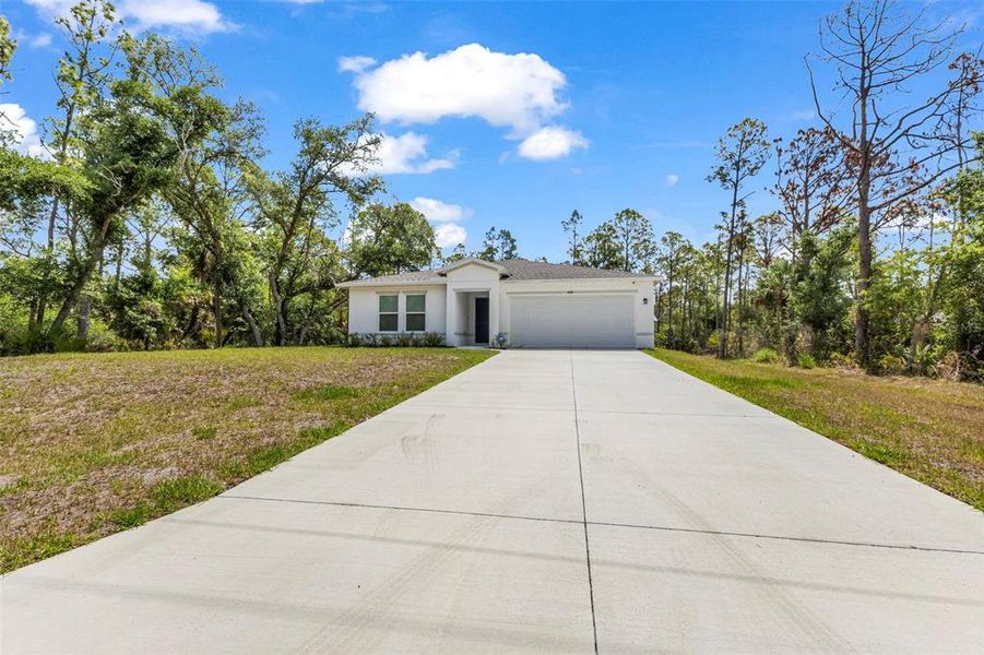 Front exterior of a new home in , Port Charlotte, FL, highlighting curb appeal (Image 18).
