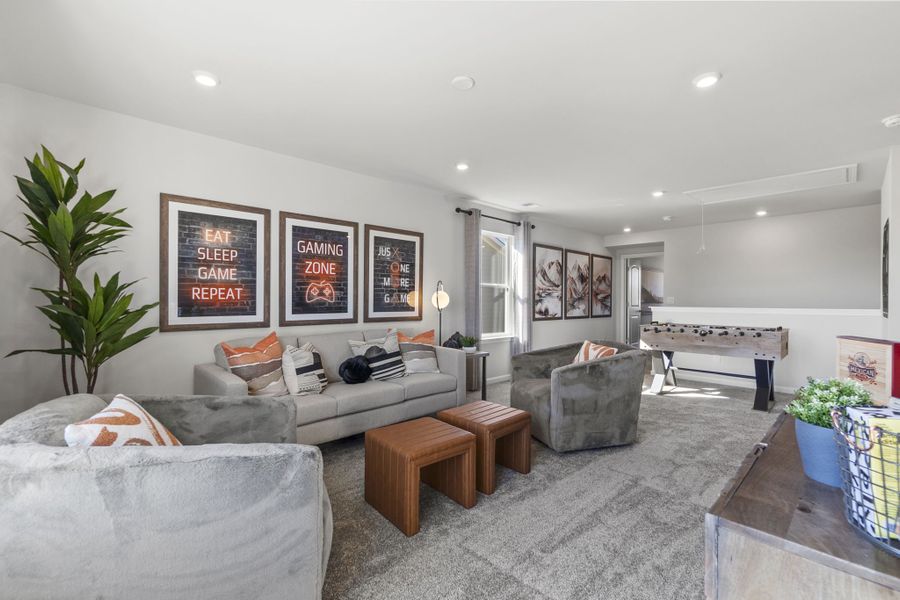 A living room with a couch and a table.