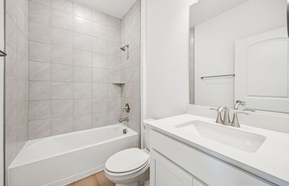 Spacious secondary bathroom with oversized shower*real home pictured
