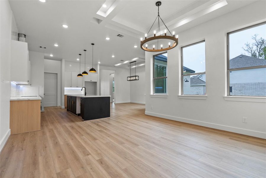 View of the living room, dining room, and kitchen View of the living room, dining room, and kitchen