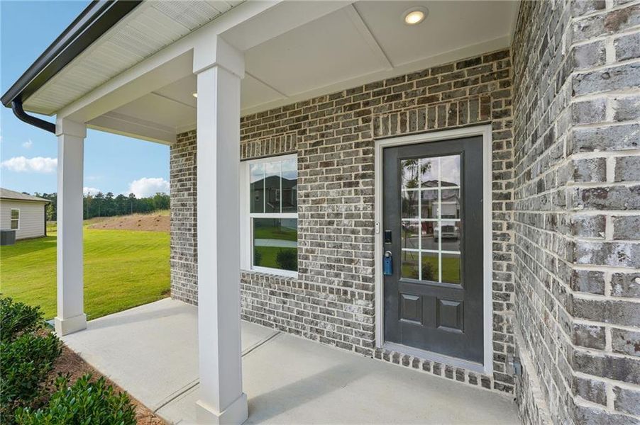 Exterior details and patio area of a home in Northwoods at Mirror Lake, Villa Rica (Image 27).