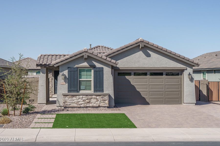 Front exterior of a home in the Calistoga at Estrella Commons community, located in Goodyear, AZ (Image 9). Front exterior of a home in the Calistoga at Estrella Commons community, located in Goodyear, AZ (Image 9).