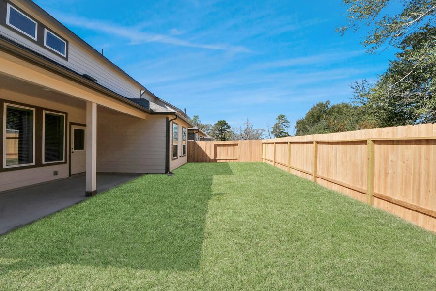 Come and see this spacious backyard with its beautiful covered patio. There is plenty of room for the kids to play and adults to relax. Perfect for your outdoor living space, patio furniture, bbq pit, and so much more. The possibilities are endless!