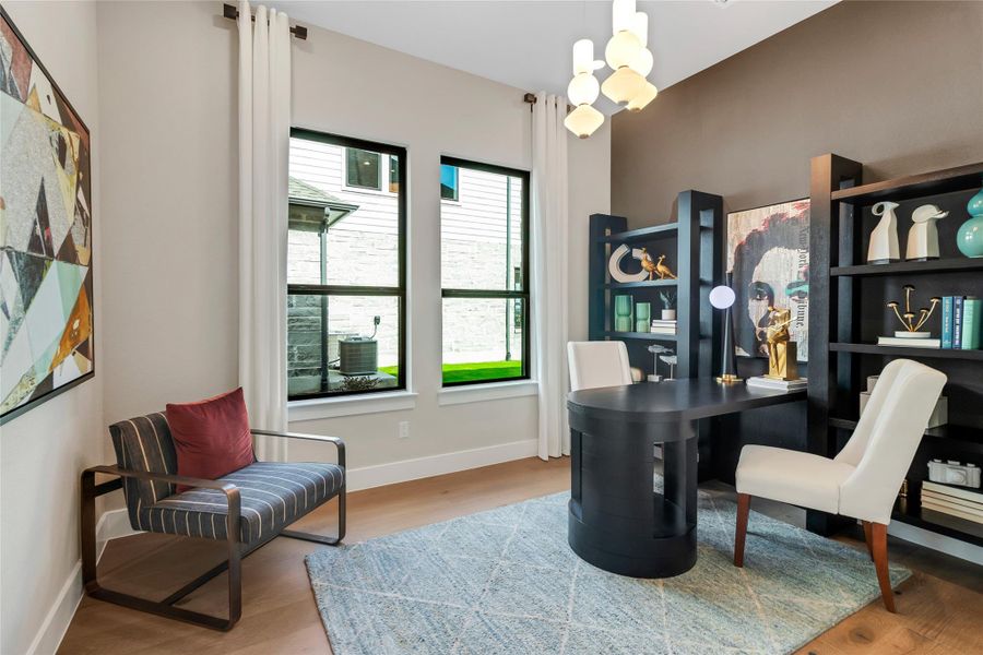 Office with wood finished floors and a chandelier Office with wood finished floors and a chandelier