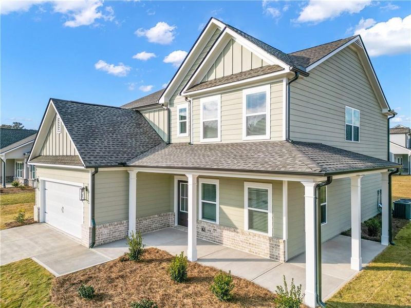 Front exterior of a new home in Harmony Farms, Eatonton, GA, highlighting curb appeal (Image 19).