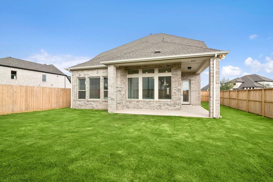 Front exterior of a new home in Harvest Green 45', Richmond, TX, highlighting curb appeal (Image 25).