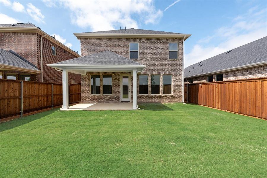 Exterior details and patio area of a home in Spiritas Ranch, Little Elm (Image 4).
